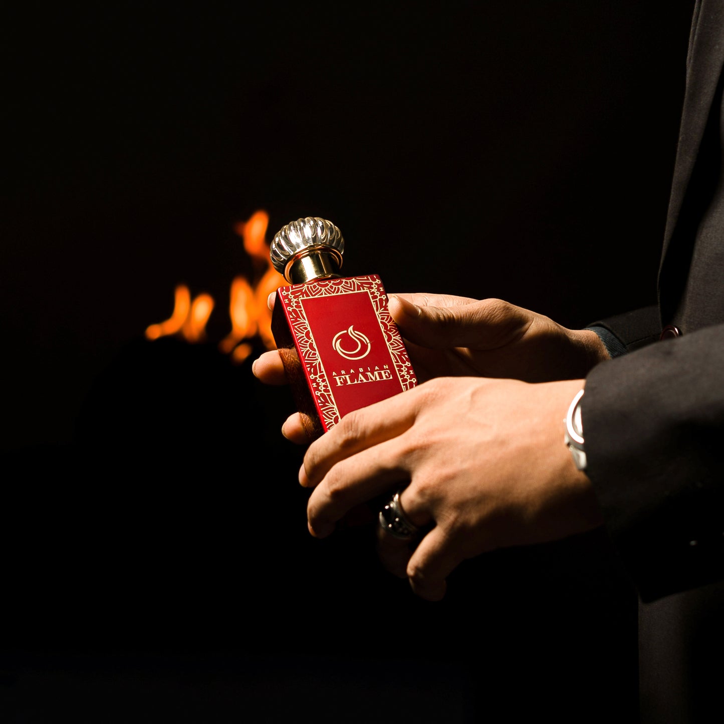 Arabian Flame Perfume Bottle with Red Floral Design, In Hands, 100ml Extrait de Parfum
