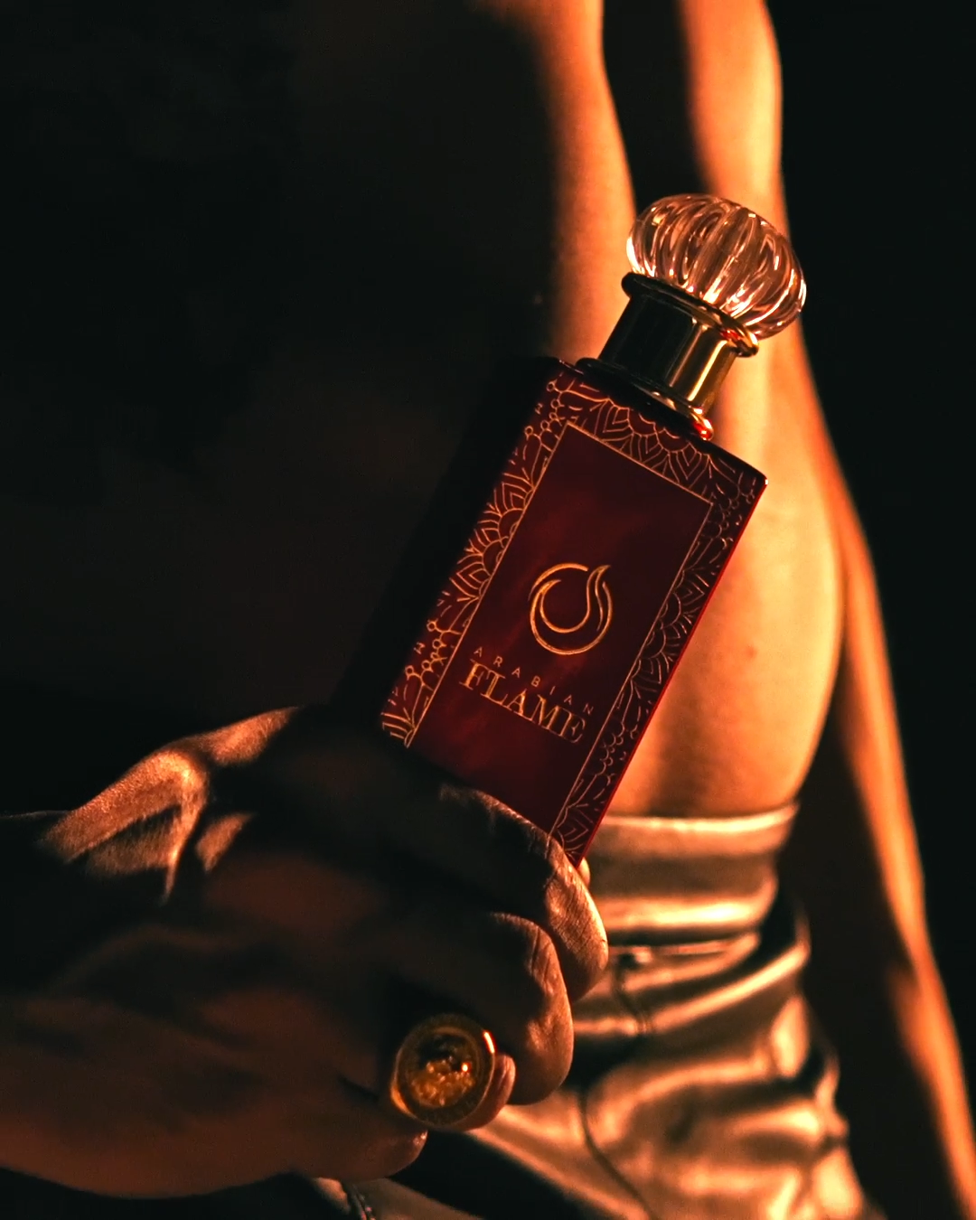 Arabian Flame Extrait de Parfum - Luxurious Red Bottle in Hand, 100ml
